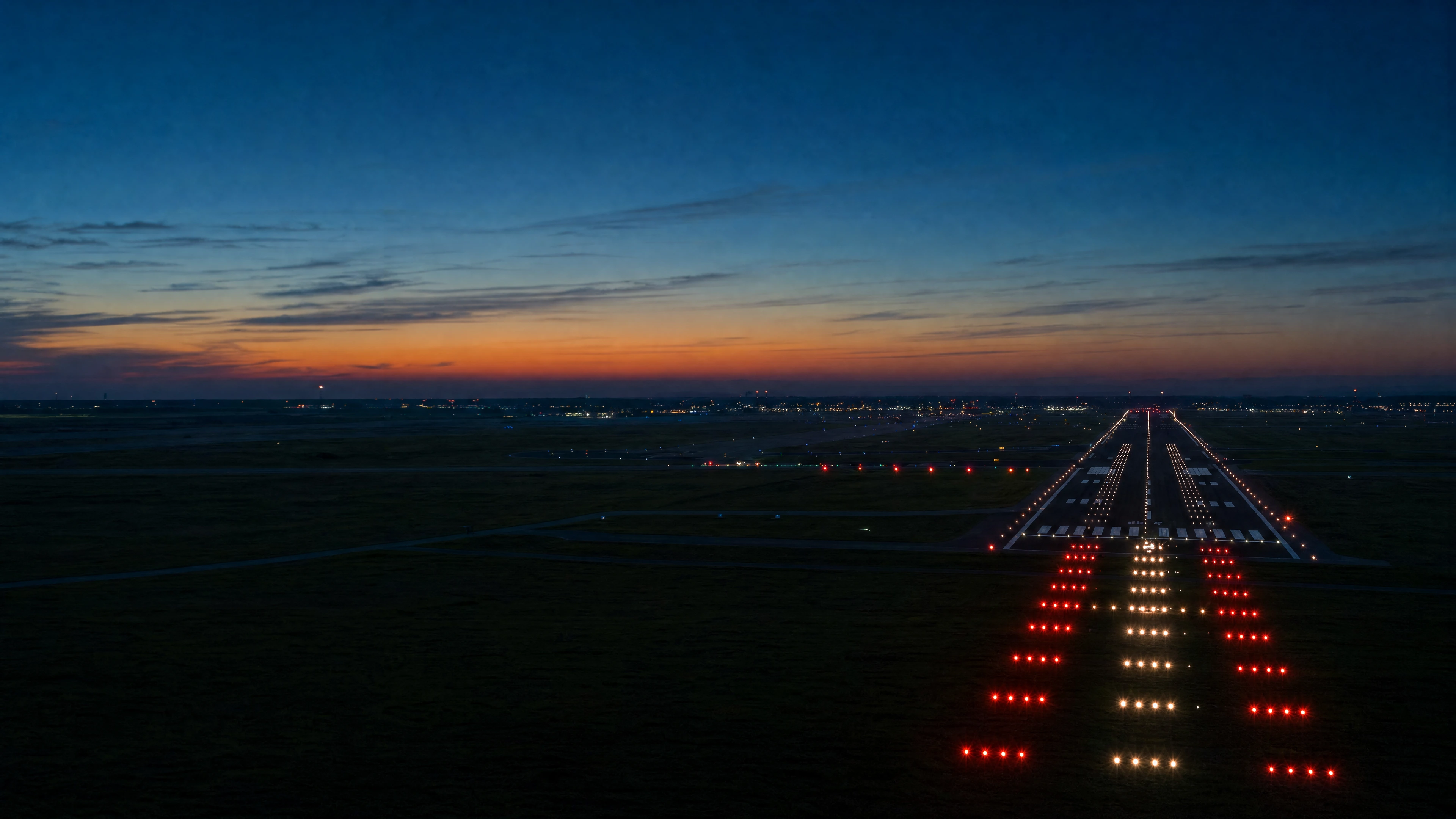 Illuminated runway and airport infrastructure